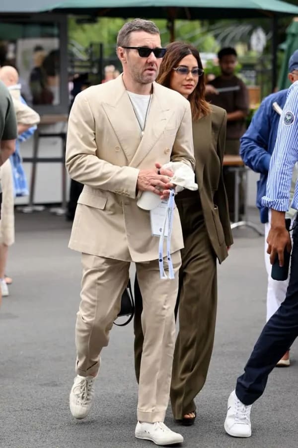 Joel Edgerton kept things sharp yet casual in a tan suit and trainers as he arrived for day six of the tournament.