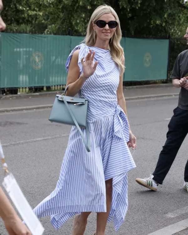 Nicky Hilton Rothschild topped best-dressed lists at SW19 in an asymmetrical striped Monse dress, finished off with a Hermès Kelly bag.