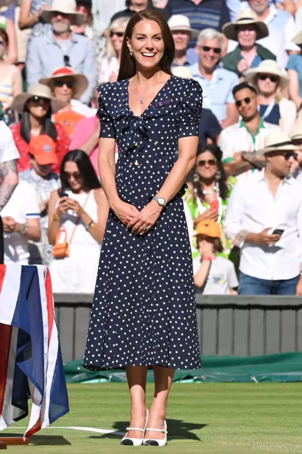The 2022 ladies' final brought one of the most celebrated Wimbledon looks in recent memory — a navy and white polka-dot Alessandra Rich tea-length dress with a sailor collar, paired with crisp white cap-toe slingbacks. | Photo: WireImage