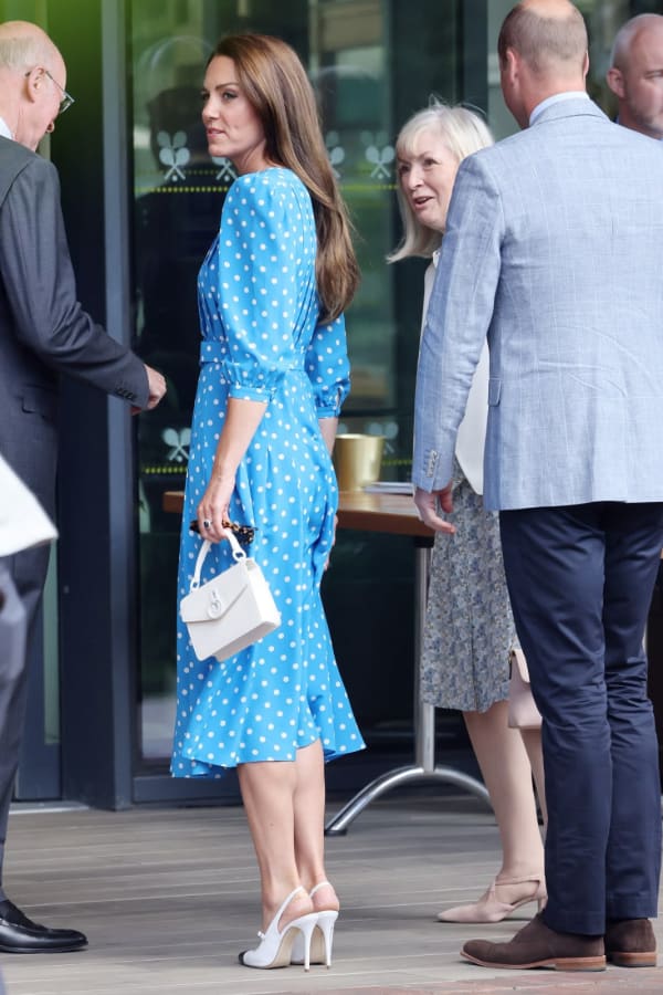 Earlier in the 2022 tournament, she rewore an Alessandra Rich blue-and-white polka-dot belted dress — first seen at a Platinum Jubilee event — a consciously sustainable choice that also aligned with Wimbledon's eco-themed messaging that season. | Photo: Getty Images
