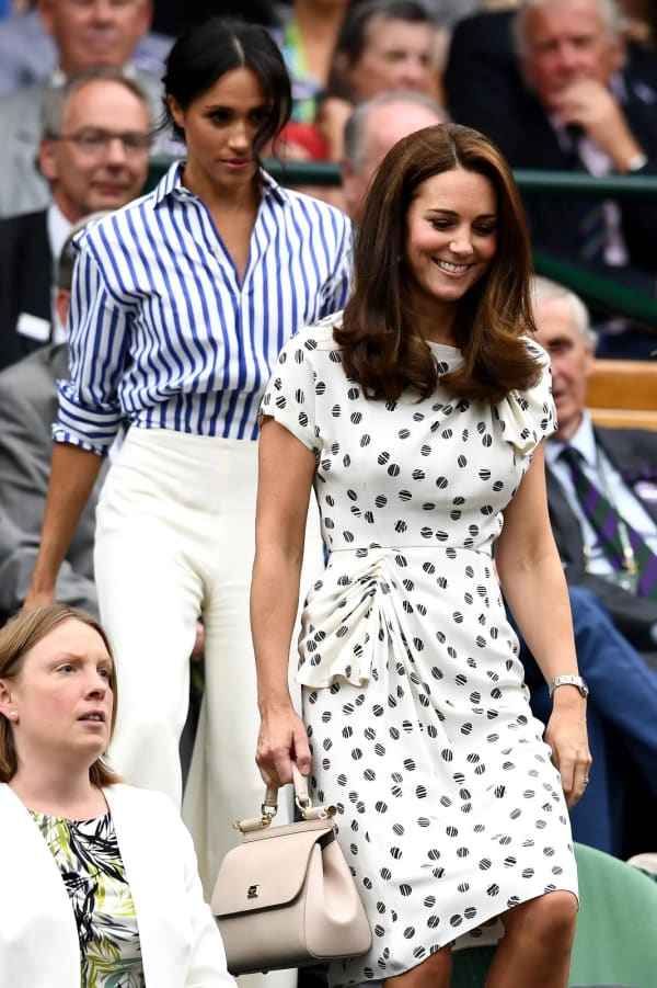 The 2018 Championships saw the Duchess of Cambridge take her seat in a graphic black-and-white polka-dot Jenny Packham dress, its tennis-ball-esque print a playful courtside nod, accessorised with a blush leather top-handle bag. | Photo: Getty Images