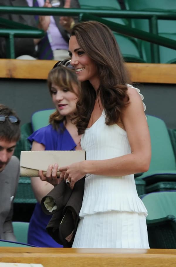 At her very first Wimbledon as a married royal in 2011, she wore a white tiered Temperley London 'Moraiah' dress with hand-embroidered straps and a floaty ruffled skirt — a look so sought-after the dress sold out within the hour. | Photo: Getty Images