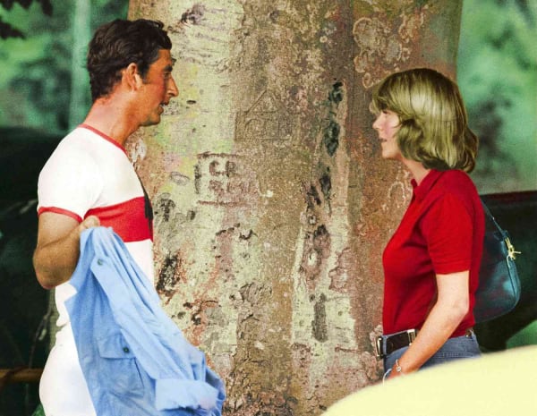 A young Prince Charles and Camilla Parker Bowles share a moment together, pictured in the 1970s. The two shared a long and complicated relationship spanning decades.