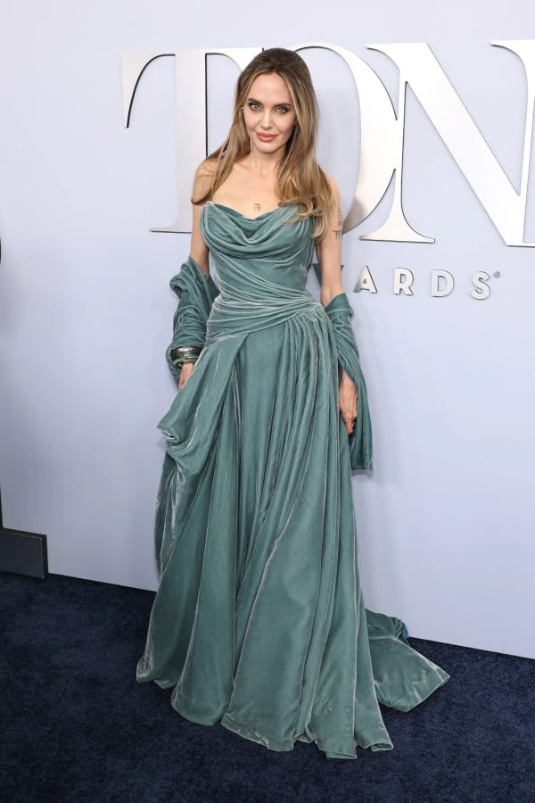 77th Annual Tony Awards, 2024 — Jolie arrived with daughter Vivienne in a sweeping strapless teal velvet Atelier Versace ballgown with draped gloves and a silver cuff, turning the Broadway ceremony into a full fashion event.