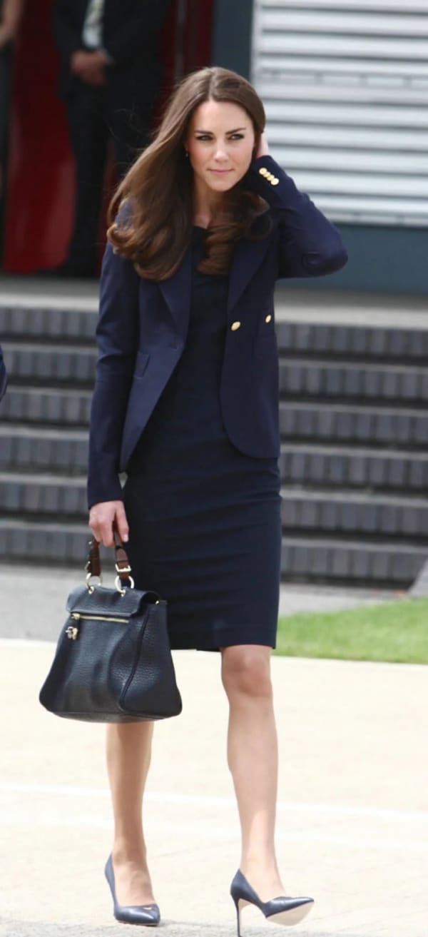 The Princess of Wales cuts a chic figure in Roland Mouret's navy Manon dress and a Smythe blazer at Heathrow Airport on 30th June 2011, ahead of the royal tour of Canada.
