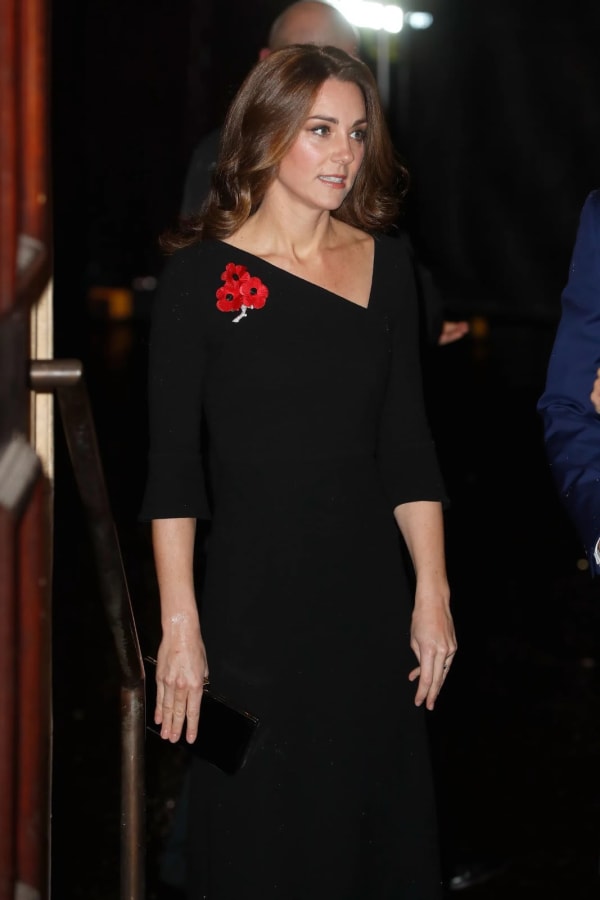 The Princess of Wales cut a poised figure in her Roland Mouret asymmetric-neck black wool dress — paired with a triple-poppy brooch — at the Royal British Legion's Festival of Remembrance at the Royal Albert Hall in November 2018.