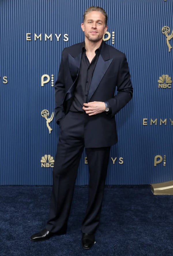 Monster: The Ed Gein Story nominee Charlie Hunnam wore a custom navy double-breasted Burberry suit with a navy silk lapel and matching navy silk shirt. - Getty Images.