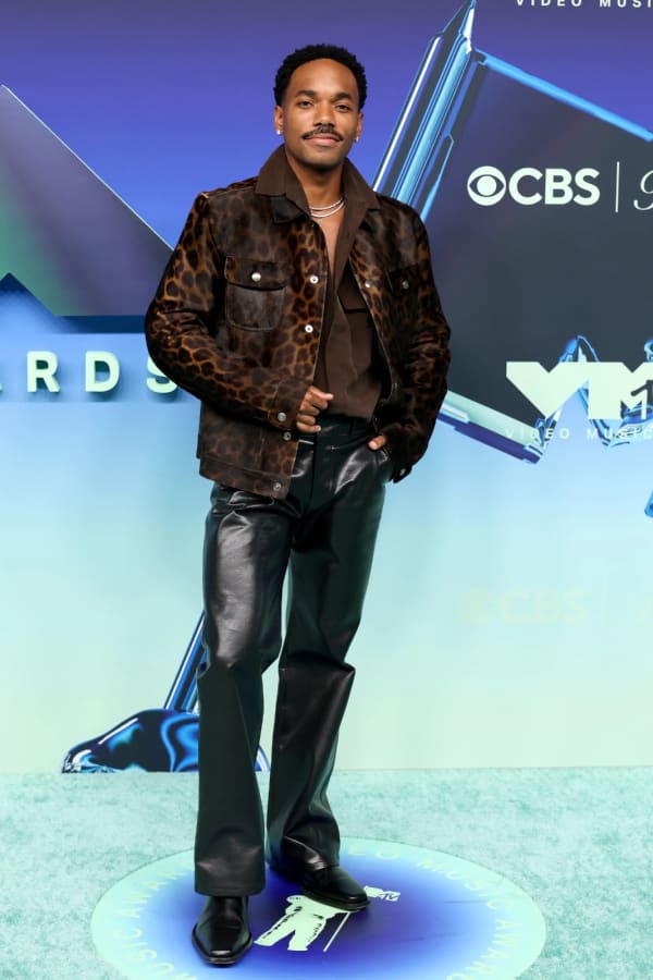 Carter Gregory turned heads on the MTV VMAs red carpet at the Peacock Theater in Los Angeles, wearing a bold leopard-print archival Tom Ford jacket paired with leather trousers.
