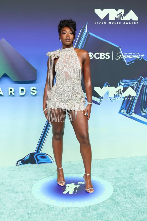 Love Island USA's Aniya Harvey turned heads on the MTV VMAs red carpet at the Peacock Theater in Los Angeles on 27 September 2026, dazzling in a crystal-embellished halter minidress with dramatic fringe detailing by Mariah Harper Designs.