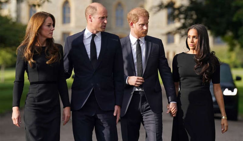 Catherine, Princess of Wales, Prince William, Prince Harry, and Meghan Markle walking together in black mourning attire outside Windsor Castle.