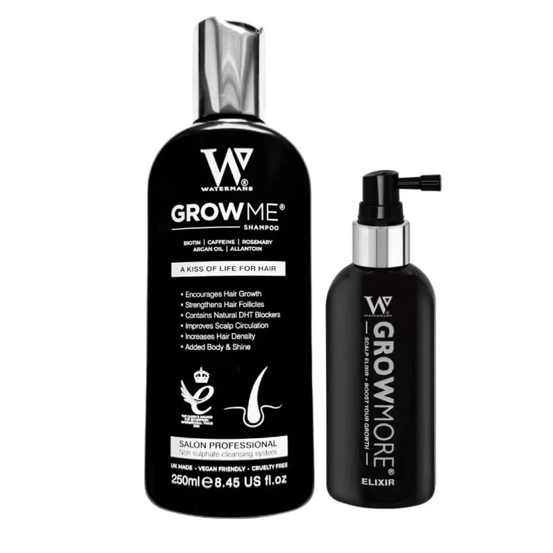 Two black bottles of Watermans hair growth products — the "Grow Me" shampoo and "Grow More" scalp elixir — against a white background.