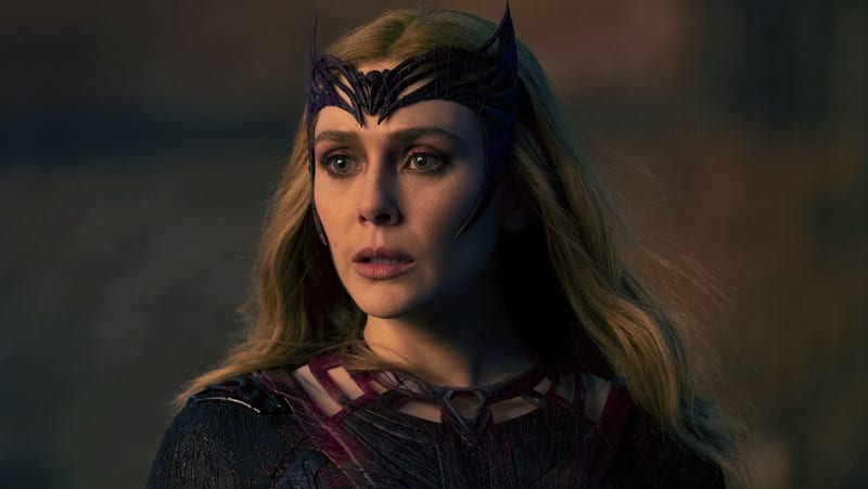 Elizabeth Olsen as Scarlet Witch in full costume and headdress in a scene from Doctor Strange in the Multiverse of Madness.