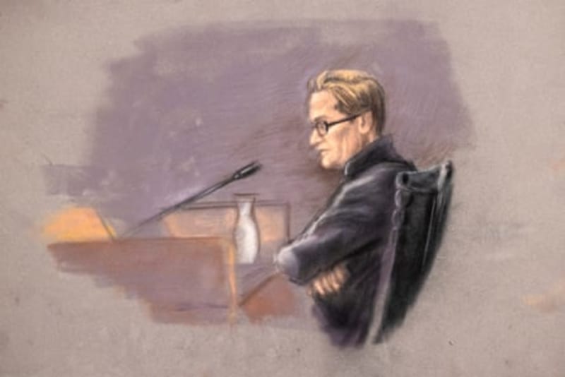 Court sketch of Marius Borg Høiby wearing glasses and a dark jacket, seated at a courtroom desk with arms crossed near a microphone and water pitcher.