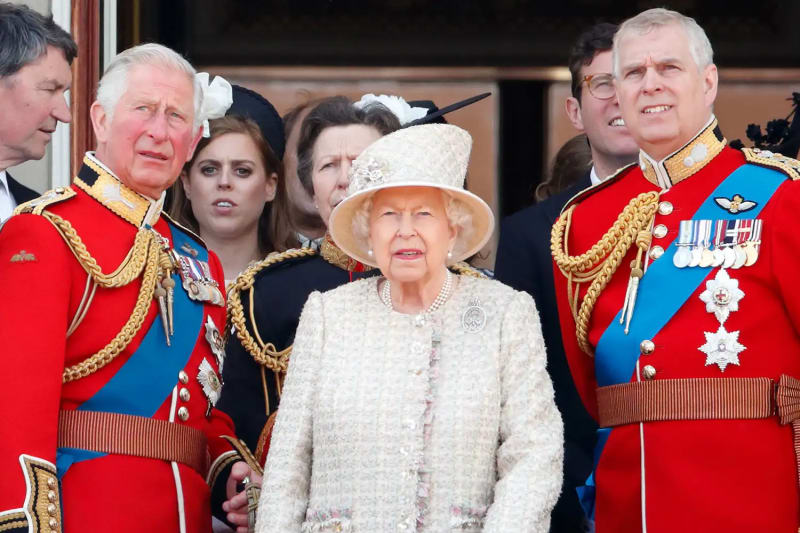 Prince Charles, Queen Elizabeth, and Prince Andrew watch a flypast from the balcony of Buckingham Palace during Trooping The Colour on June 8, 2019