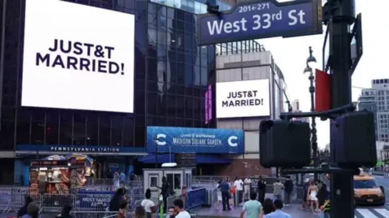 Two large digital billboards outside Madison Square Garden on West 33rd Street display the message