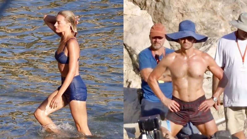 Two film set photos: woman in navy blue bikini and shorts standing in water; shirtless man in plaid shorts near rocky coastline with crew members behind him.
