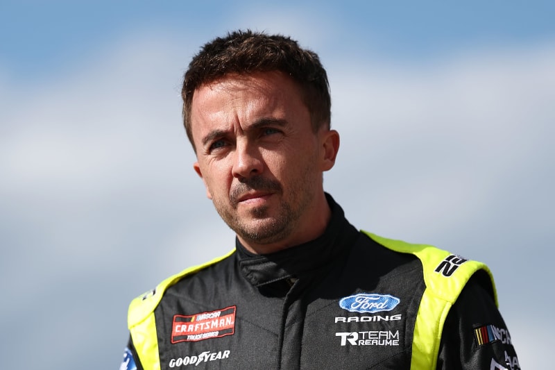 Professional race car driver in NASCAR Craftsman Truck Series uniform with Ford Racing and Team Requiem sponsorships.