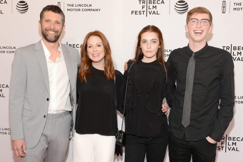 Two men and two women posing at Tribeca Film Festival step-and-repeat backdrop.