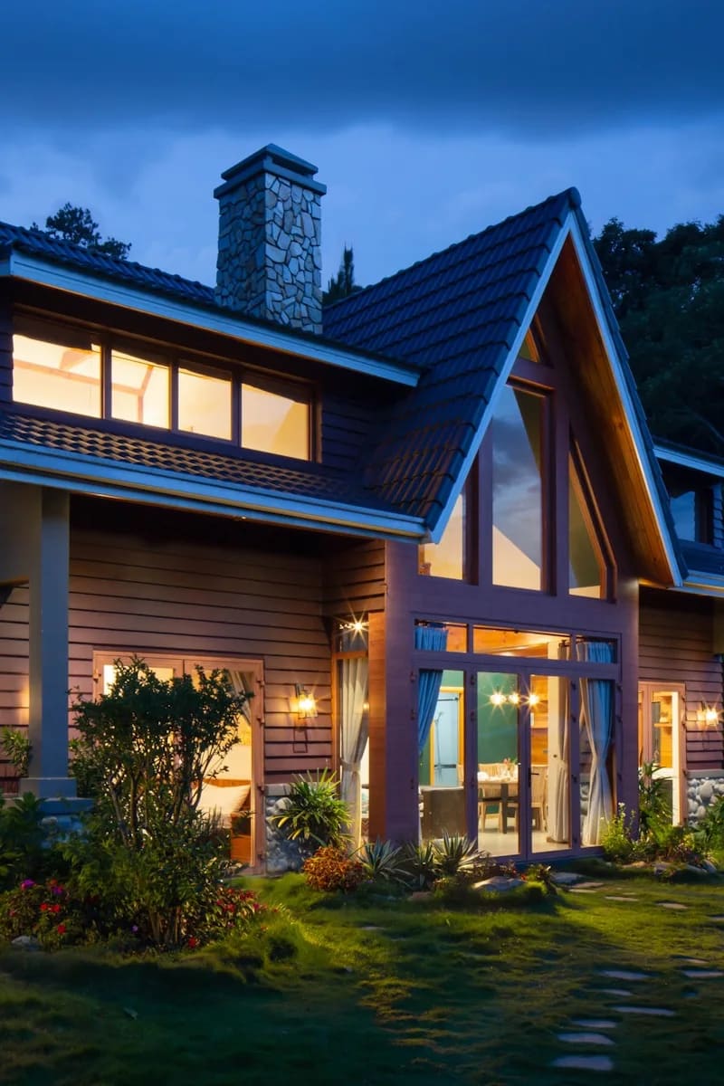 Well-lit upscale home exterior at dusk in Newton — professional window cleaning services available in this neighborhood