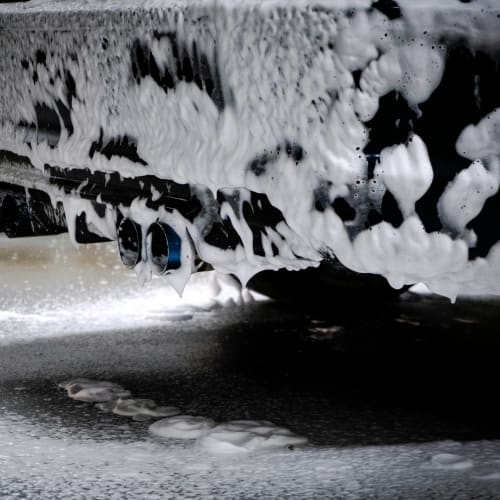 Tire shining being applied to a black tire