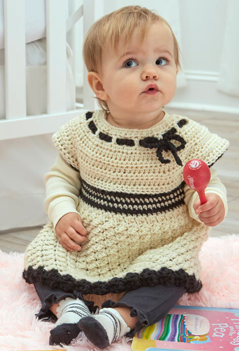 Baby tunic laid flat showing yoke and bodice