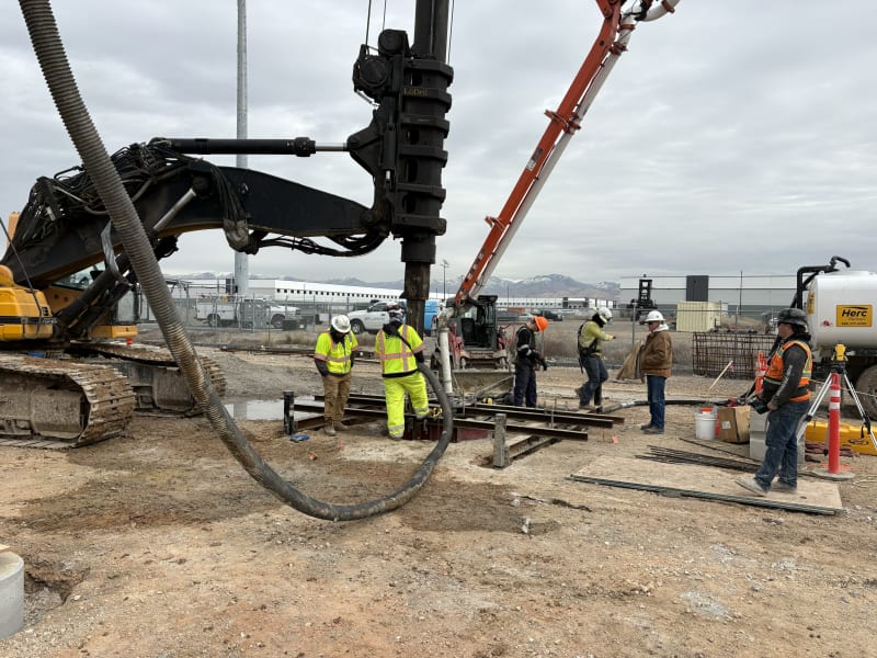 Alpine crew drilling a pier foundation for a transmission structure on an Arizona utility corridor