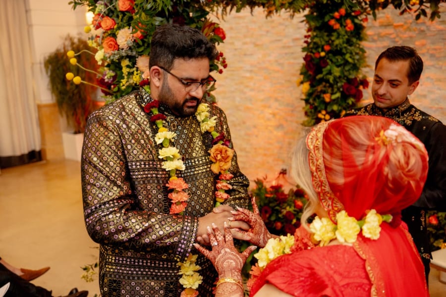 Traditional wedding rituals with marigold garlands