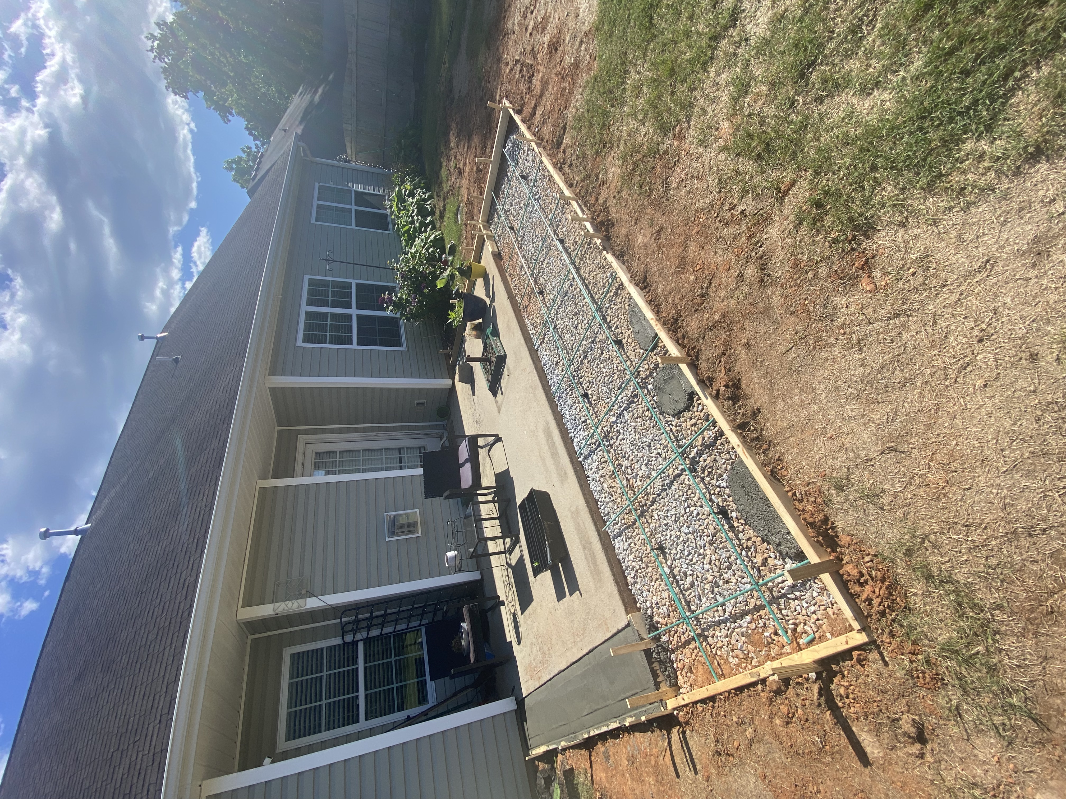 Custom decorative concrete patio with outdoor living features