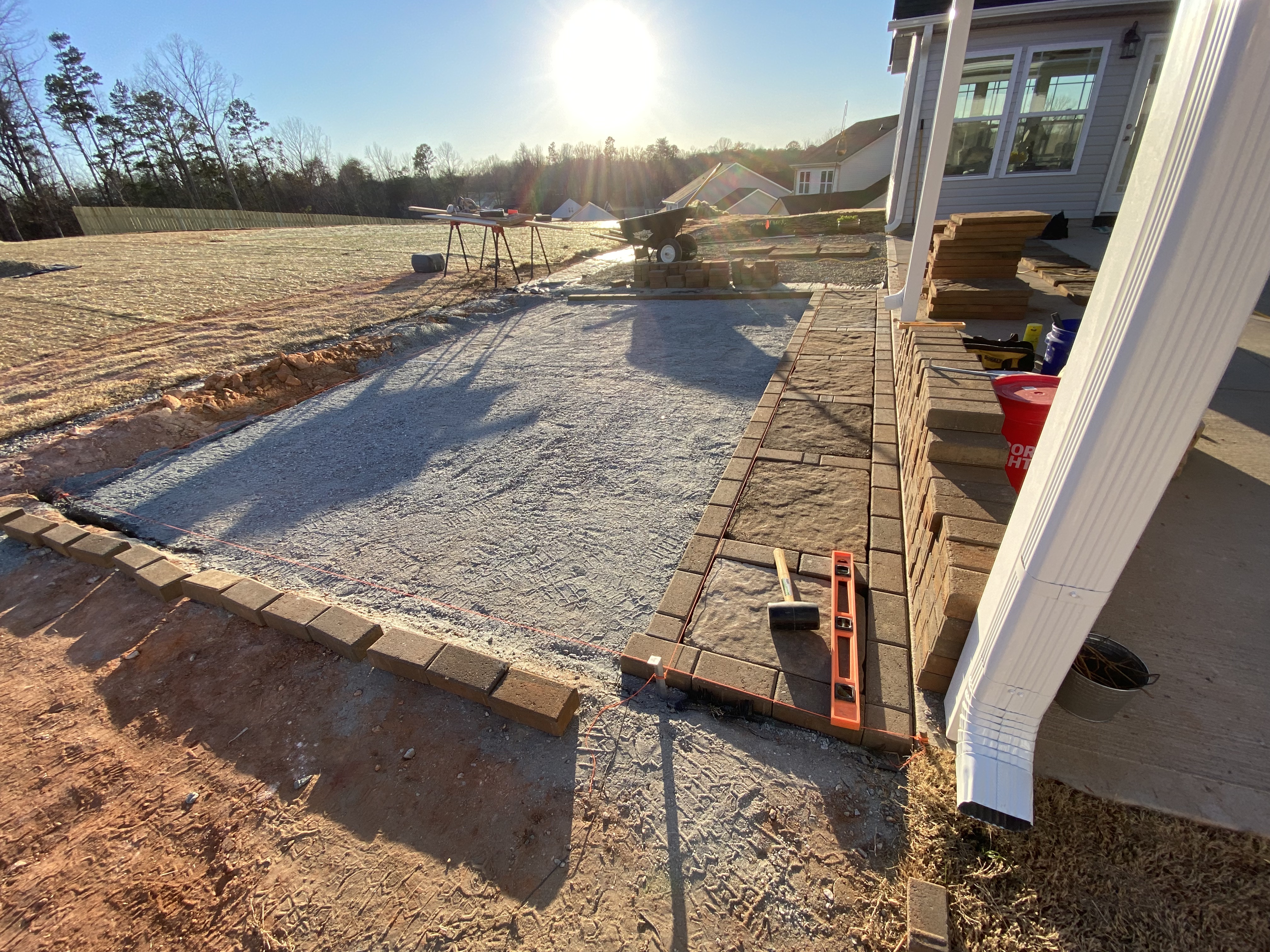 Custom patio design with integrated seating and outdoor living features