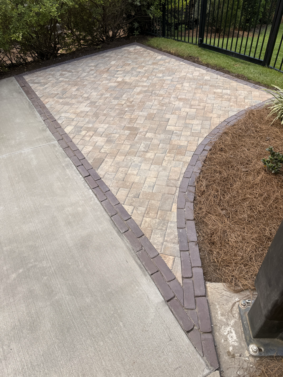Custom paver patio installation with outdoor living space