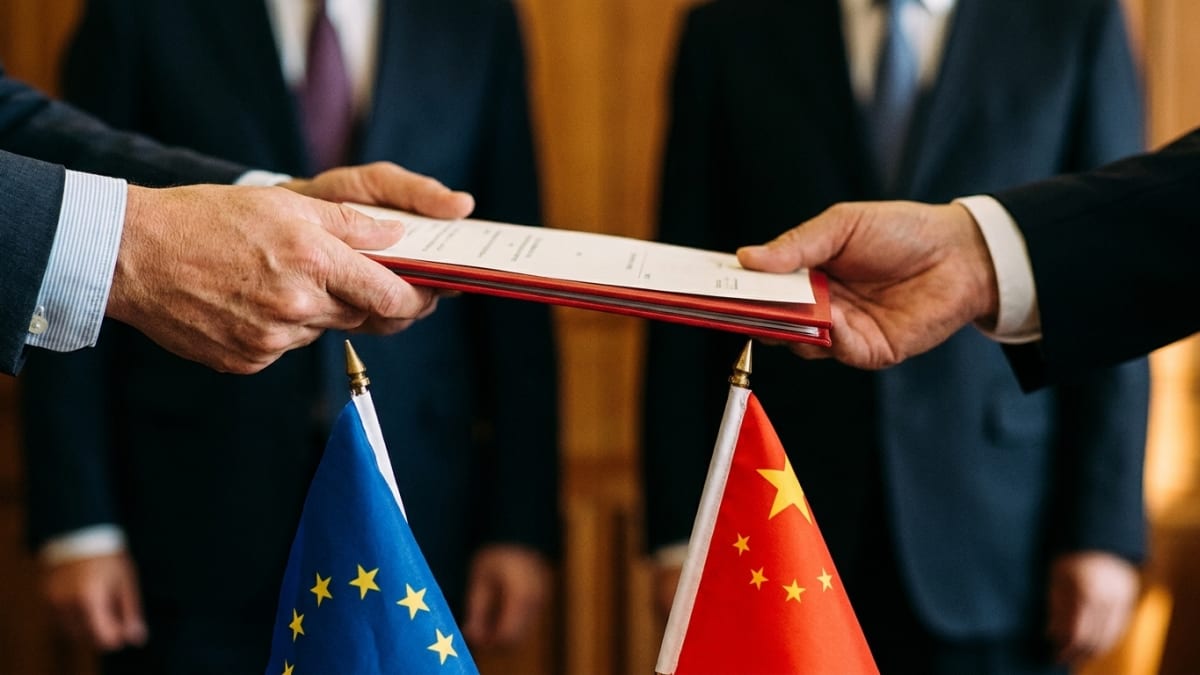 Officials' hands exchanging signed documents over small EU and Chinese flags