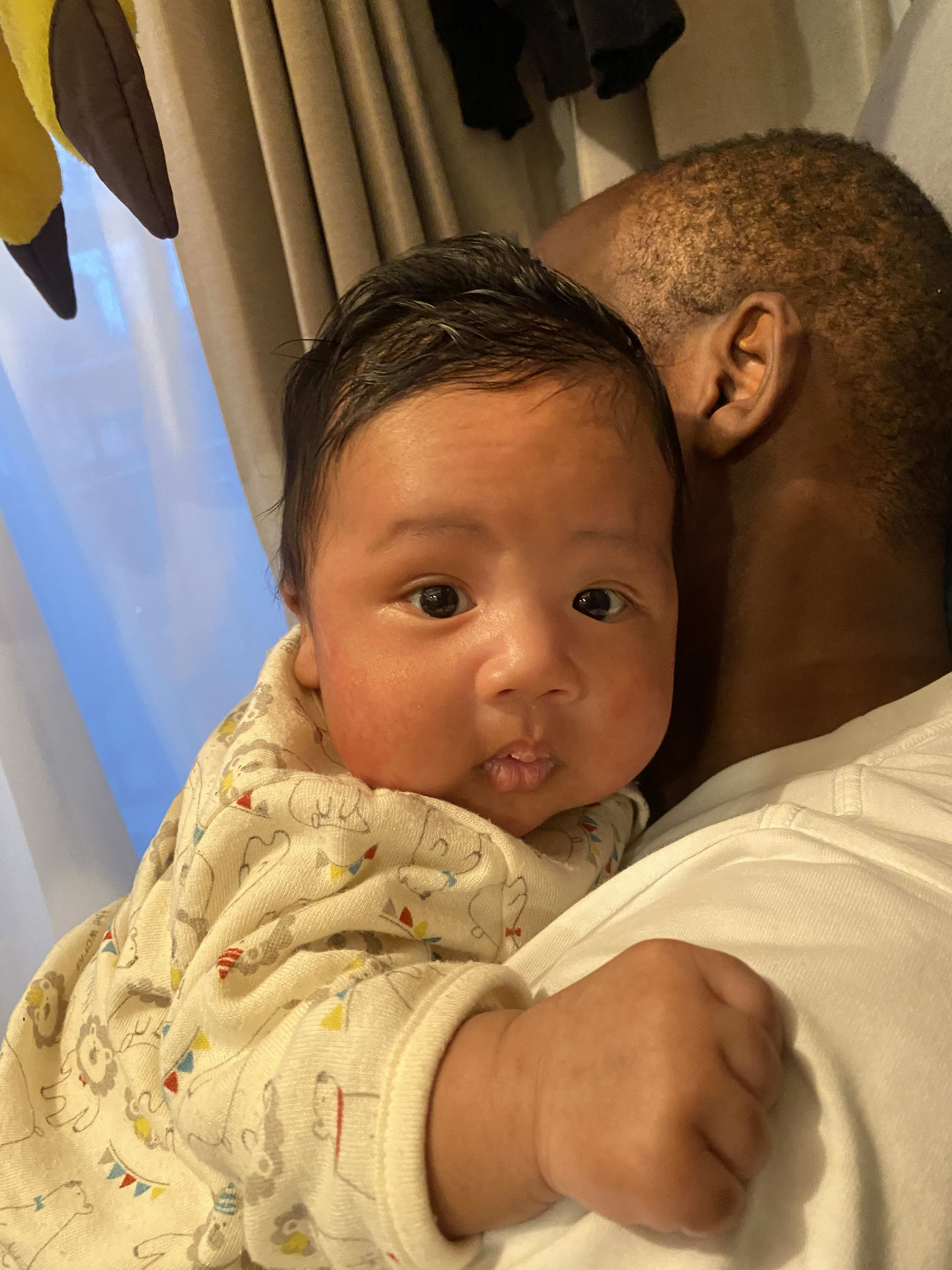 He seems to like to be held by daddy