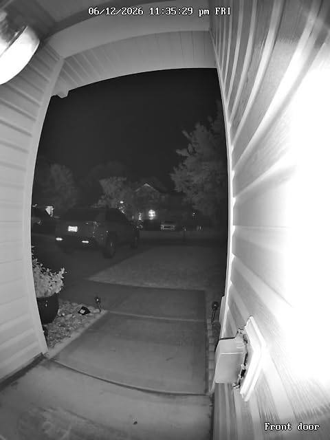 Black and White Night Vision live stream feed showing the porch and driveway under infrared illumination