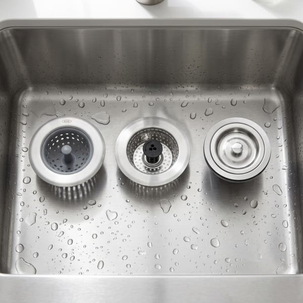 A modern, clean kitchen sink with a high-quality strainer installed