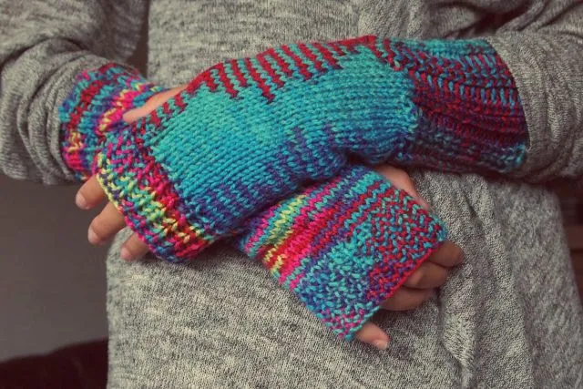 An image showing hands in warm clothes.