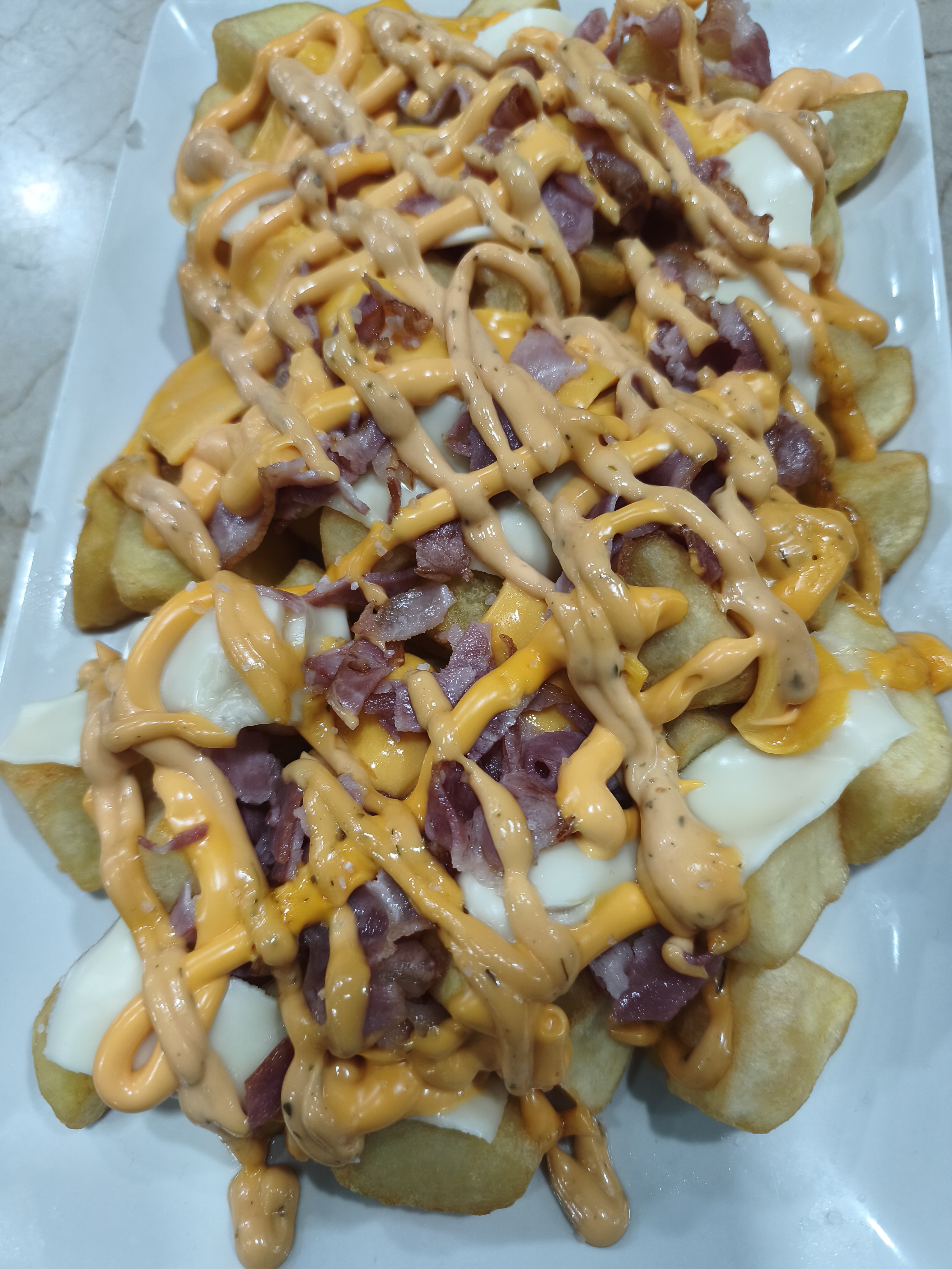 Patatas con chedar y bacon