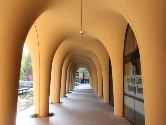 Arts West's recessed ground level Arts West fits best for Melbourne University