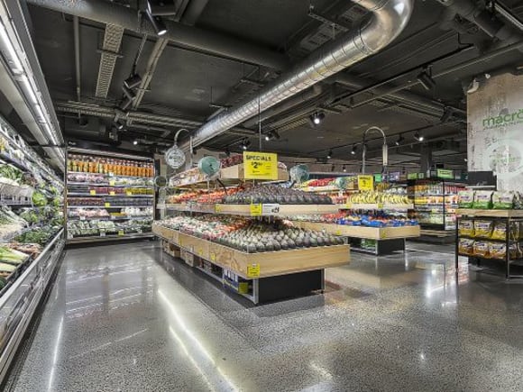 The interior of the Woolworths at Omnia has employed a pared back industrial aesthetic. Image: Supplied Greenland Australia's Omnia welcomes Wooloworths Metro as first tenant in retail podium