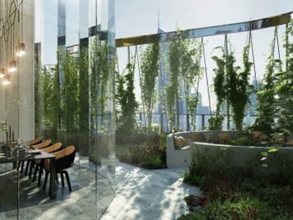 An outdoor garden terrace with indoor dining and lounge space. Premier Tower amenities