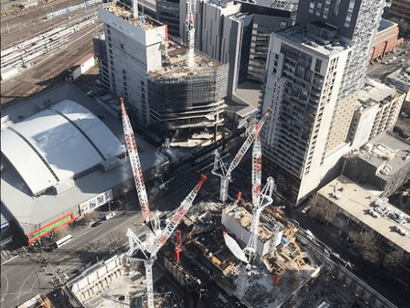Two sites, three towers, eight cranes. Image: Probuild Probuild tops out at 271 Spring Street