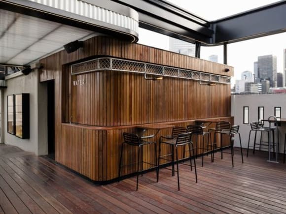 The curved forms draw on the Art Deco Curtin House. Image: Image: Tom Blachford Raising the bar - Technē revamps Rooftop Bar and Cinema