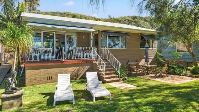BBC correspondent Michael Peschardt purchases at Great Mackerel Beach