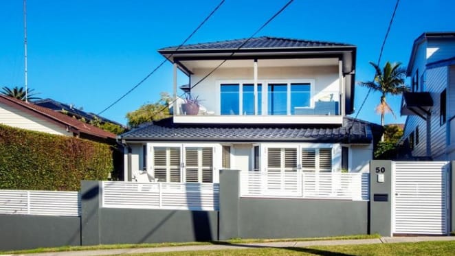 Swans coach John Longmire lists Malabar home