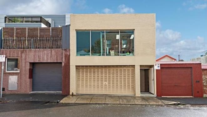Scooter hire company sign North Melbourne tenancy