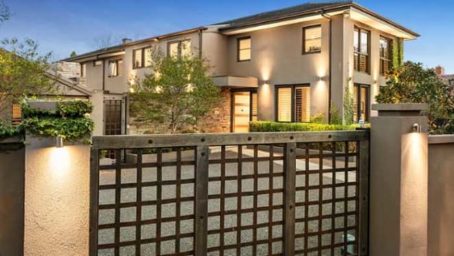Retired St Kilda footballer and coach Grant Thomas sells in Brighton