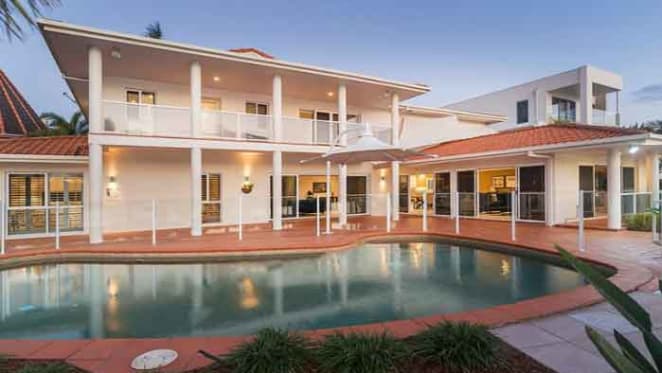 Gold Coast mayor Tom Tate sells at Paradise Waters
