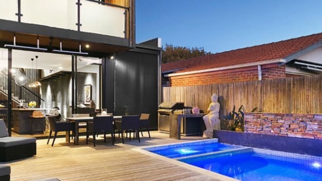Departing Melbourne Demons coach Paul Roos sells in Elwood