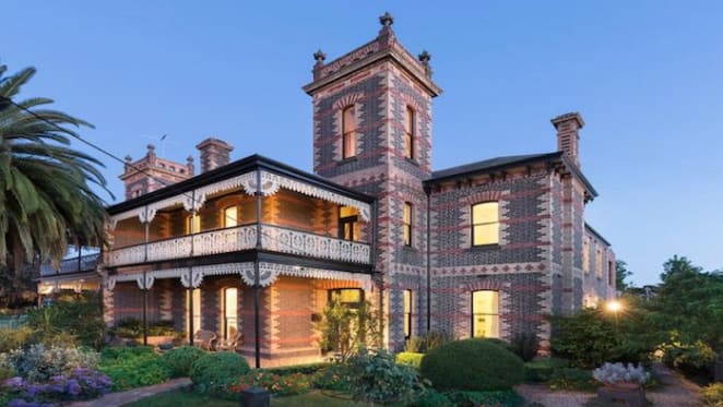 Coburg mansion, built as a mirror-image of next door, listed for sale