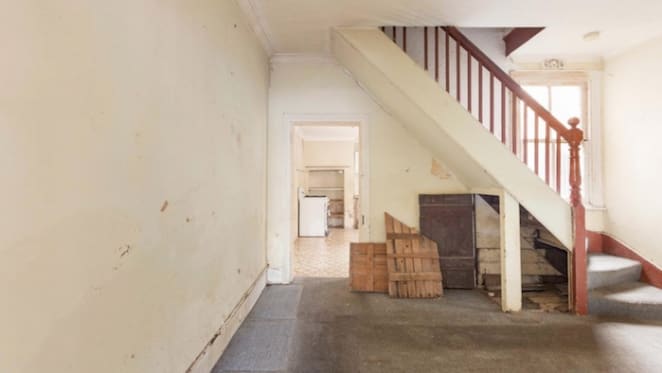 Hammered as Redfern derelict terrace sells for less