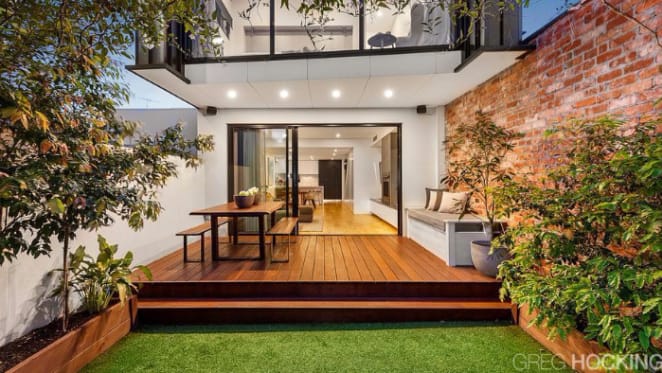 Retired North Melbourne skipper Andrew Swallow lists in Albert Park